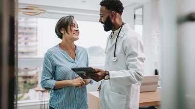 Doctor and patient reviewing her medical plan.