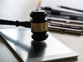 Gavel on desk.