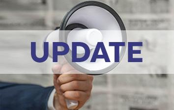 A hand holding a bullhorn with the word "Update" in front of image.