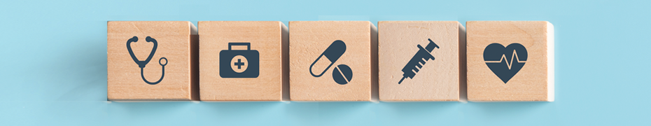 Building blocks with healthcare symbols.