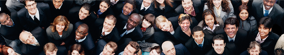 A group business people looking up at a camera.